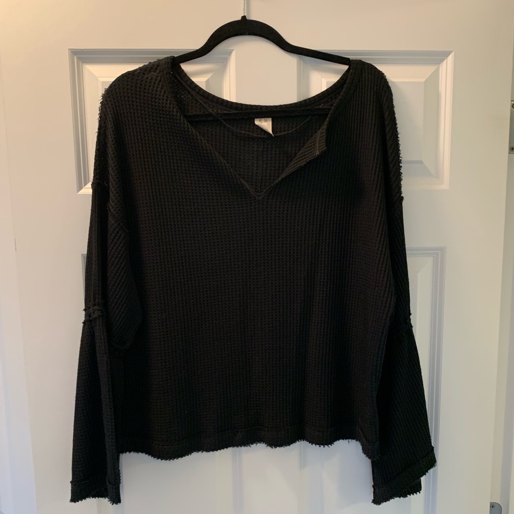 Black free people top with bell sleeves.